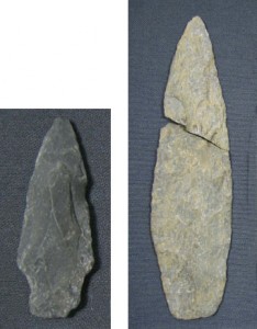 This projectile point (left) was found on the shoreline of St. George's Bay, and is made of Ingonish Island rhyolite. The artifact on the right is a large biface (used as a spear point or knife) and also is made of Ingonish Island rhyolite. Its form suggests it is more than 3,000 years old. Artifacts like these have been found throughout Mi’kma’ki. From the collections of the Nova Scotia Museum, Archaeology Collections, Halifax, NS.