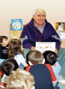 The late Elder Raymond Cope sharing stories, thoughts, knowledge, and feelings with children in the Millbrook Community.