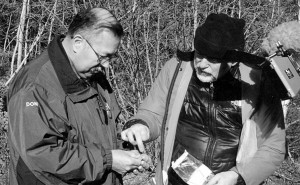 Dr. Don Julien and David Christianson, Nova Scotia Museum, looking at artifacts similar to ones being held at the Canadian Museum of History in Gatineau, Quebec. Presence is key to site protection.