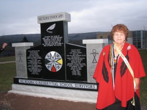Elder Phyllis Googoo stands by the Indian Residential School Commemoration monument at Waycobah First Nation in December 2012 Waycobah, Nova Scotia.