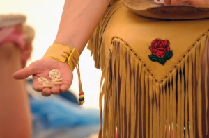 Late Elder Caroline Gould shares her knowledge about the game waltes with visitors to the Membertou 400 Cultural Village in Halifax, June 2010. Image courtesy of Shirley Robb, Province of Nova Scotia.