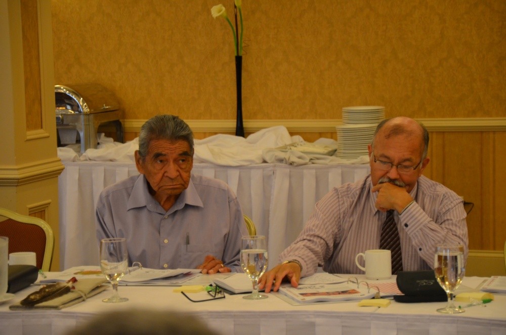 Elder Douglas Knockwood (Sipekne’katik First Nation) sits with Donald Julien (Millbrook First Nation), Executive Director of The Confederacy of Mainland Mi’kmaq and member of the Netukulimk (Economic, Social, and Political Life) group.