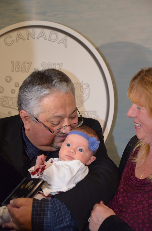 Gerald Gloade, with granddaugher Nina and wife Natalie Gloade. 